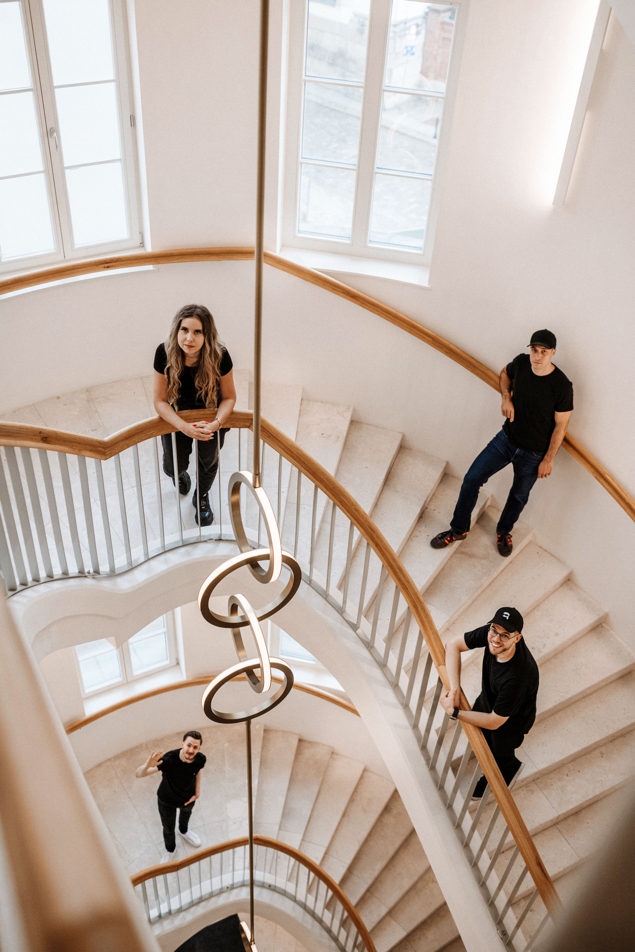 Heveli team standing on stairs